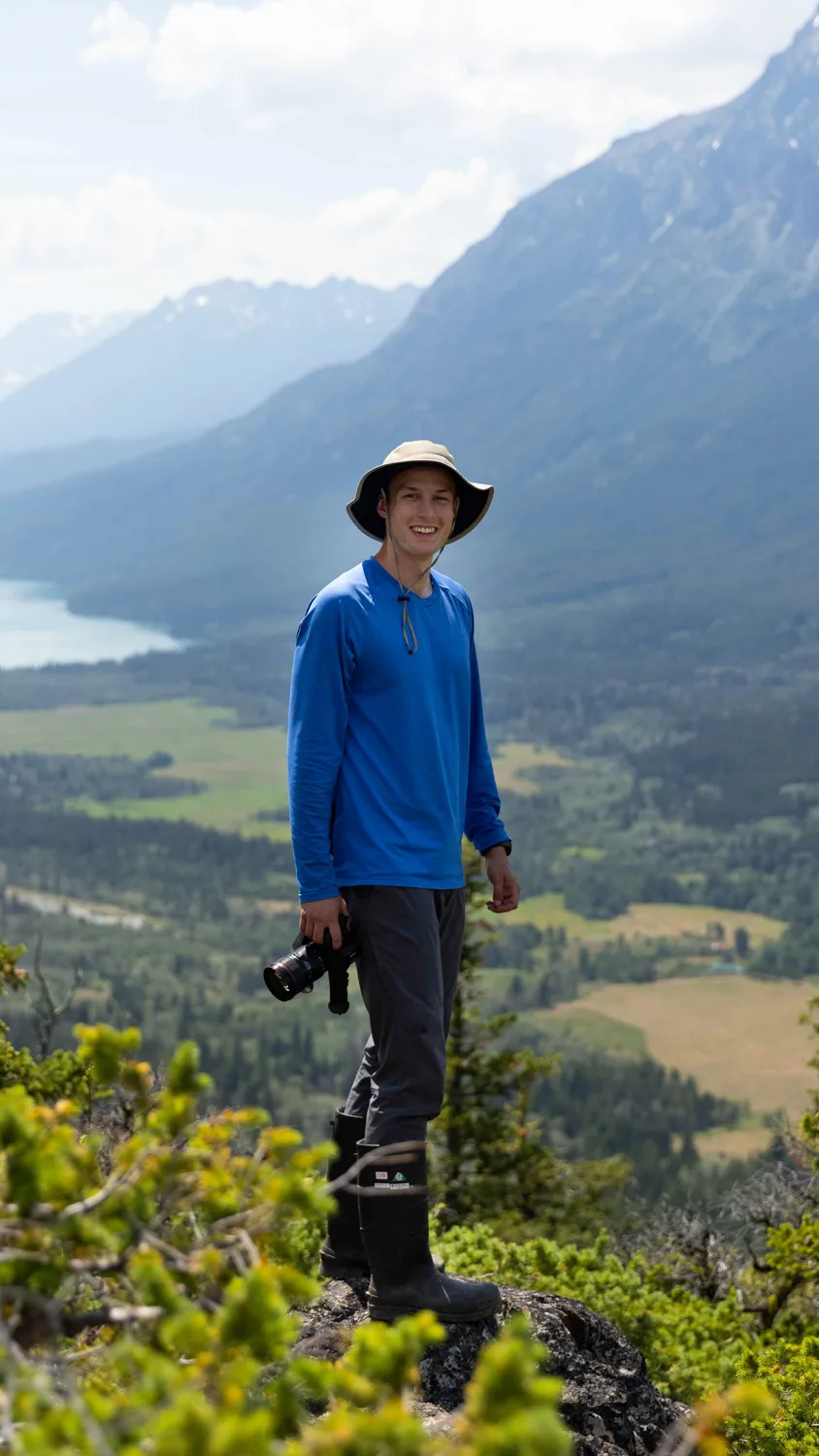 Brendan on a mountain ridge in British Columbia with his camera